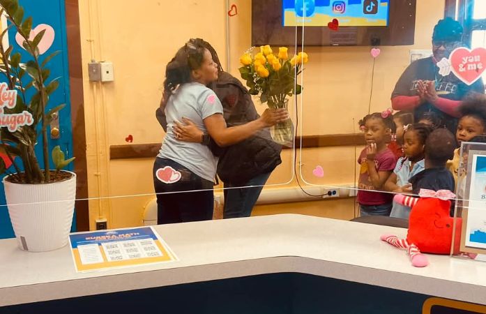  Prinicpal Clayton hugs Mrs. Wilkins